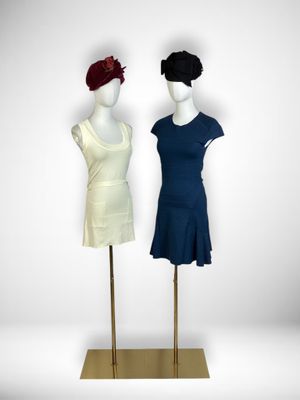 two mannequins that are standing next to each other