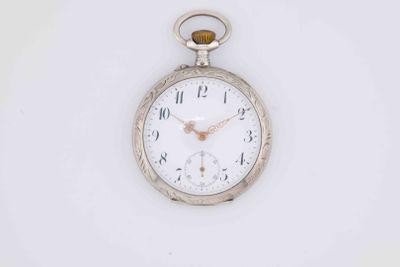 a silver pocket watch on a white surface with a white background