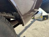 a close up view of a car ' s tire with mud on it