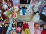 a lot of dolls that are sitting on a table