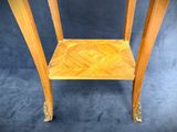 a small table with a wooden shelf on it