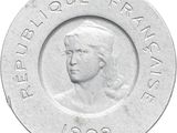 une image représentant une pièce de monnaie sur laquelle figure le portrait d'une femme