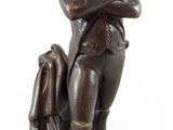 bronze statue of a man with a hat and a dog