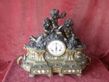 a clock that is sitting on top of a red cloth