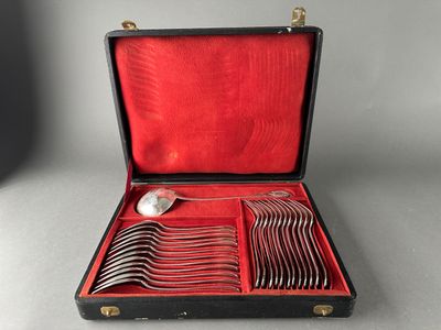 a black case with silverware in it on a table