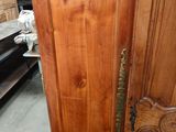 a very large wooden door in the middle of a room