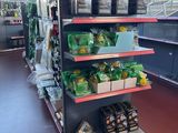a large display of food in a store with a lot of shelves