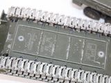 a close up of a metal chain attached to a cell phone