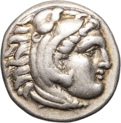 a silver coin with a head of a woman on it