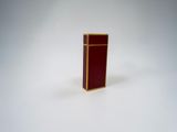 a lighter that is sitting on a white surface