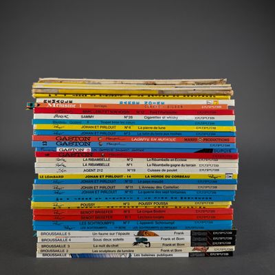 many books stacked on top of each other on a table