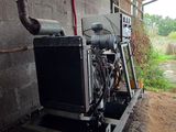 a large air conditioner that is sitting in the corner of a building
