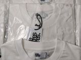 a white shirt that has a tag on the front of it