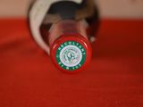 a close up of a bottle of wine on a table