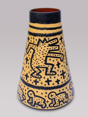 a vase with a design on it on a gray background