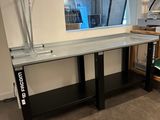 a glass table with a mirror on it in a room