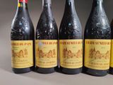 six bottles of wine are lined up on a table