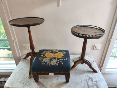 a small table with a small stool on top of it