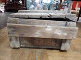 a wooden box that is sitting on the floor