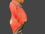 a statue of a clown wearing a hat and a red shirt