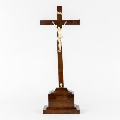 a wooden cross with a crucif on top of it