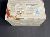 a box of pokemon trading cards on a table