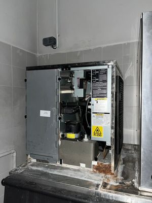 a machine that is sitting in the corner of a room