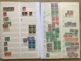 a lot of stamps on the pages of a book