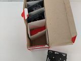 a box of electronic components sitting on a white surface
