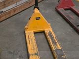 a forklift sitting on the floor in a warehouse