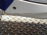 a close up of a boat on a metal surface