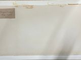 an old picture of a piece of paper with a tag on it