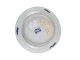 a white plate with a blue and white design on it