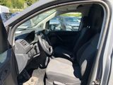 the interior of a car with the door open and the driver ' s seat down