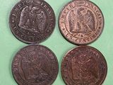 three different types of coins are shown on a green surface