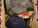 a box with a hat and other items inside of it