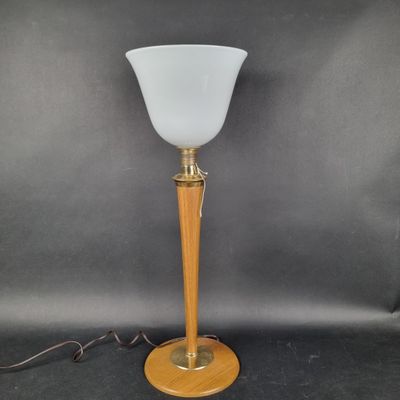 a lamp with a wooden base and a white glass shade