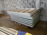 a stack of wooden pallets in a warehouse