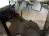 the back seats of a car with a seat belt in the back of it