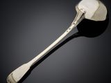 a close up of a spoon with a spoon handle on a black surface