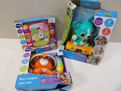 three toys are in boxes on a white surface