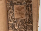an old book with a picture of a statue on it