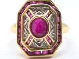 an image of a gold ring with a pink stone in the center