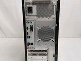 a small computer on a white surface with a white background