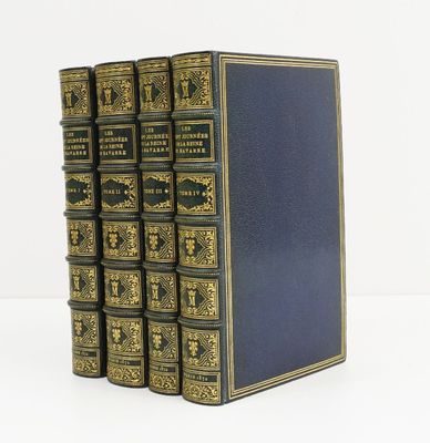 a set of five books with gold trimming and blue covers