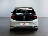 the rear view of a white volkswagen e - pace car in a showroom