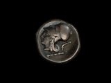 une image représentant une pièce d'argent sur laquelle figure un éléphant couché sur le dos