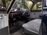 an old car with the door open and the driver ' s seat up