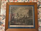 tableau encadré représentant un homme à cheval tirant une calèche