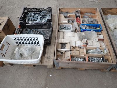 two crates of screws and other tools on the ground